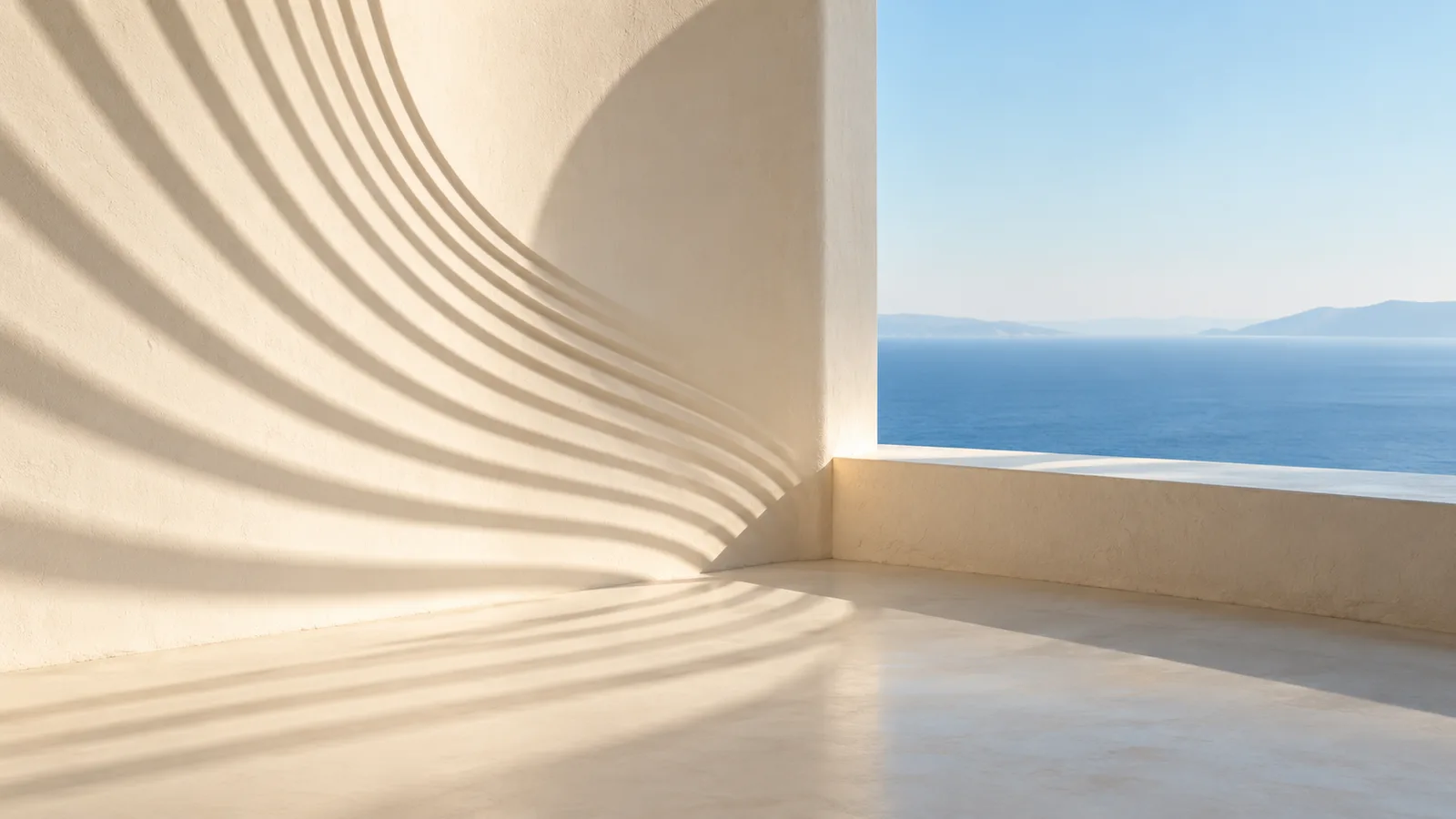 Fine sunlit arcs ripple outward from a sculptural corner, then settle into still lines
