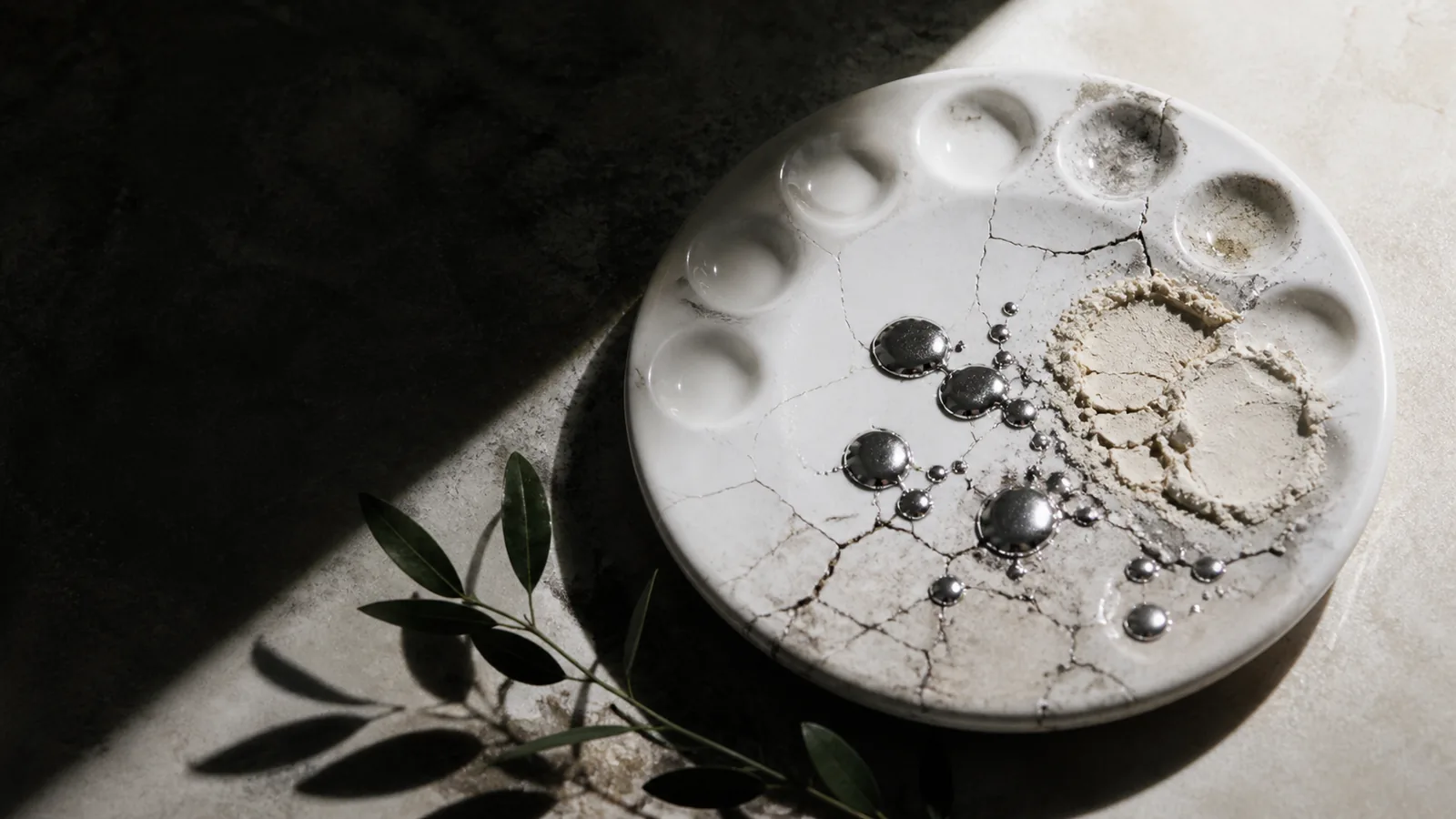 Unbranded cosmetic jars beside a molecular filter and a separated metallic droplet