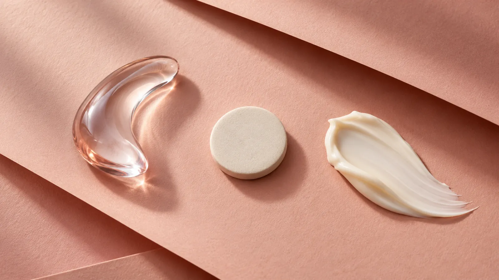 Three distinct abstract delivery shapes arranged on a warm ivory background